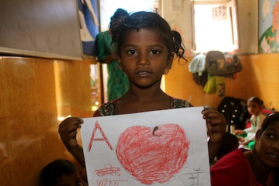Jamie.Mumbai.ChildWithAppleDrawing.101612